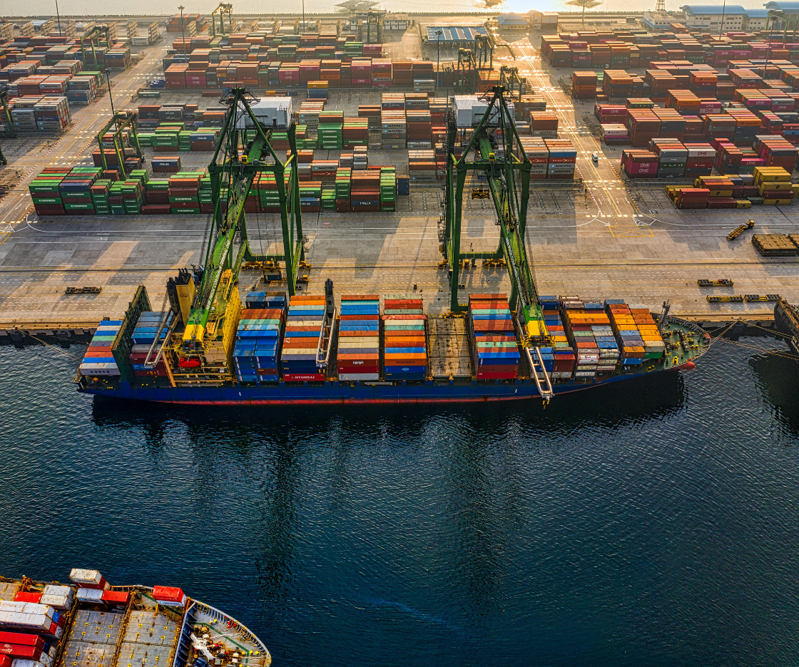 Contact Container port terminal with cranes and cargo ships