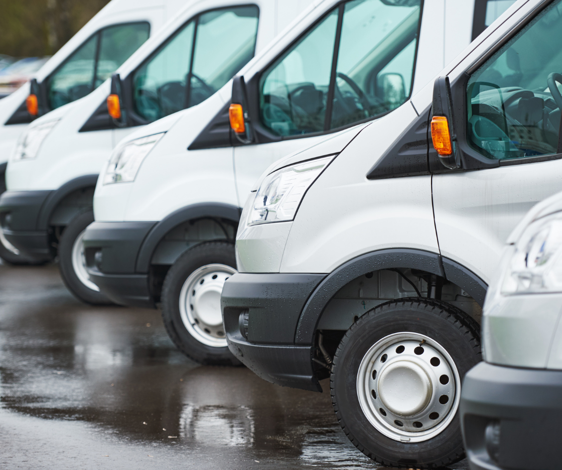 Row of white commercial vans